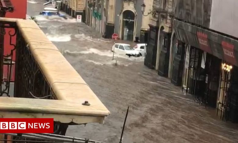 Catania: Two dead as rare storm floods streets of Sicilian city