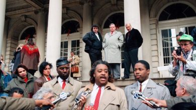 Eric Adams, right, president of the Police Guardians Association, appears at a news conference with Al Sharpton, center, and Elgin Watkins at City Hall in New York on Dec. 9, 1993.