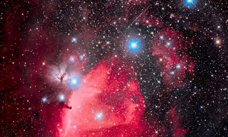 This is the Belt of Orion with its three blue stars across the top of the frame (L to R: Alnitak, Alnilam, and Mintaka), with the iconic Horsehead Nebula (aka B33) below Alnitak, with the dark Horsehead set against the bright nebula IC 434, aka Orion???s Dagger. The pinkish nebula above Alnitak is NGC 2024, the Flame Nebula. The small blue reflection nebula left of the Horsehead is NGC 2023, with smaller IC 435 to the left of it. The field is filled with the large open cluster Collinder 70. The multiple star at bottom left of centre is Sigma Orionis. Many other smaller bits of reflection nebulas populate the field in and around the Belt. This is a blend of 8 x 5-minute exposures at ISO 800 unfiltered with 6 x 10-minute exposures at ISO 1600 shot through an Optolong L-Enhance dual-band nebula enhancement filter (it lets through only Oxygen III blue-green and Hydrogen-alpha red to really enhance the nebulosity). The filtered shot is blended in with the unfiltered shot to retain the best of both worlds: the rich reds captured by the filtered images without losing the range of colours in the other nebulas such as the salmon pinks of the Flame and the blue reflection nebulas and stars. All exposures with the Canon EOS Ra mirrorless camera through the SharpStar HNT150 Hyperbolic Newtonian Astrograph at f/2.8, from home on a very clear moonless night January 27, 2020. All stacked, aligned and blended in Photoshop 2020. (Photo by: Alan Dyer/VW PICS/Universal Images Group via Getty Images)
