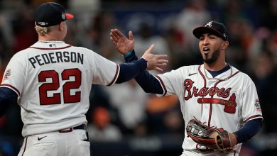 Atlanta Braves left fielder Eddie Rosario celebrates after catching a fly ball hit by Houston Astros' Jose Altuve during the eighth inning in Game 4 of baseball's World Series between the Houston Astros and the Atlanta Braves Saturday, Oct. 30, 2021, in Atlanta. (AP Photo/David J. Phillip)