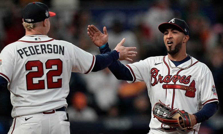 Atlanta Braves left fielder Eddie Rosario celebrates after catching a fly ball hit by Houston Astros' Jose Altuve during the eighth inning in Game 4 of baseball's World Series between the Houston Astros and the Atlanta Braves Saturday, Oct. 30, 2021, in Atlanta. (AP Photo/David J. Phillip)