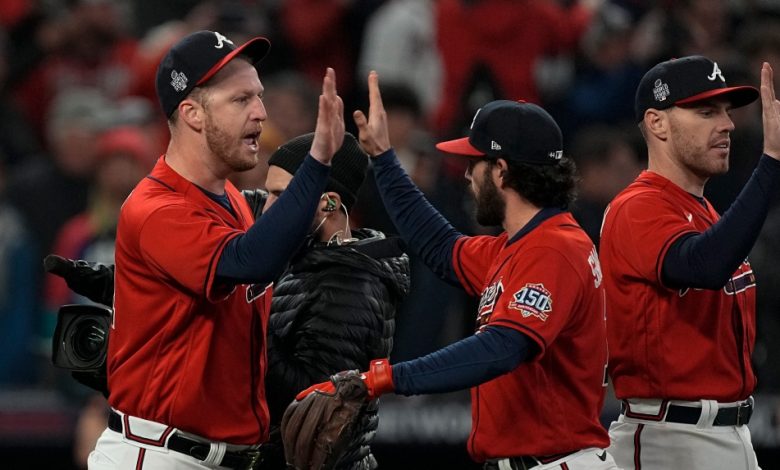 Atlanta Braves celebrate their win in Game 3 of baseball's World Series between the Houston Astros and the Atlanta Braves Friday, Oct. 29, 2021, in Atlanta. The Braves won 2-0, to lead the series 2-1games.(AP Photo/Brynn Anderson)