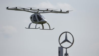 STUTTGART, GERMANY - SEPTEMBER 14: A Volocopter multirotor passenger aircraft takes off in front of the Daimler logo during the Vision Smart City event on September 14, 2019 in Stuttgart, Germany. Vision Smart City is a two-day event focusing on innovation around mobility of the future.  (Photo by Andreas Gebert/Getty Images)