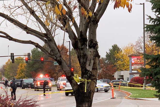 Police close off a street outside a shopping mall after a shooting in Boise, Idaho.