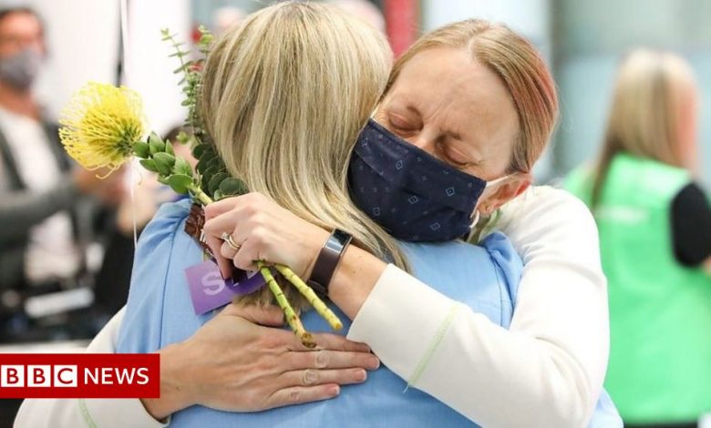 Covid: Emotional reunions as Australia's border reopens