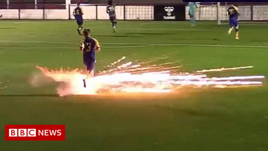 Football match abandoned after firework nearly hits player