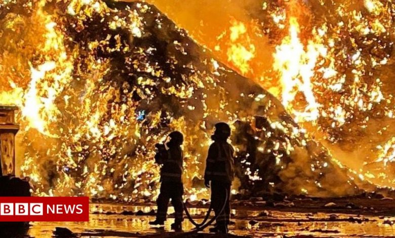 Deflecting fire: Crews tackle huge flames at recycling center