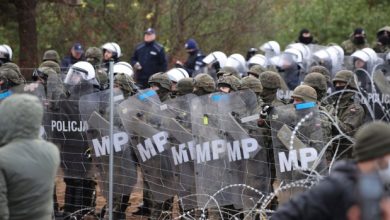 Poland ups security as migrants mass on border with Belarus