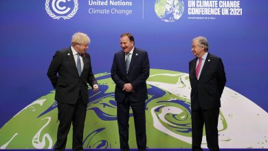 Britain's Prime Minister Boris Johnson, left, and United Nations Secretary-General António Guterres, right, greet Sweden's Prime Minister Stefan Löfven in Glasgow, Scotland, on November 1.