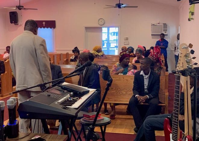 Congregation members at Nashville Light Mission Pentecostal Church after a man with a gun disrupted their service Sunday, Nov. 7, 2021. The pastor, Ezekiel Ndikumana, tackled the man and other church members held him while police responded.