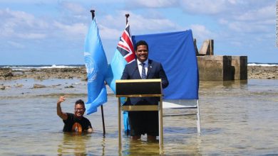 Tuvalu minister stands knee-deep in the sea to film COP26 speech to show climate change