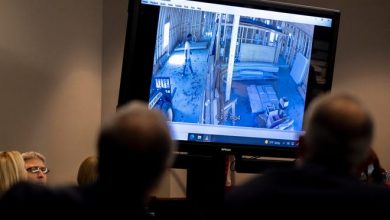 Prosecutor Linda Dunikoski shows a video of Ahmaud Arbery entering a house under construction during the trial of Greg McMichael and his son, Travis McMichael, and a neighbor, William "Roddie" Bryan in the Glynn County Courthouse, Tuesday, Nov. 9, 2021, in Brunswick, Ga.
