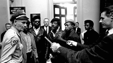 Members of the Black Panther Party argue with a California state policeman at the Capitol in Sacramento after he disarmed them on May 2, 1967.
