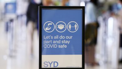  A Covid-19 safety sign is seen at Sydney's International Airport on November 1, in Sydney, Australia.
