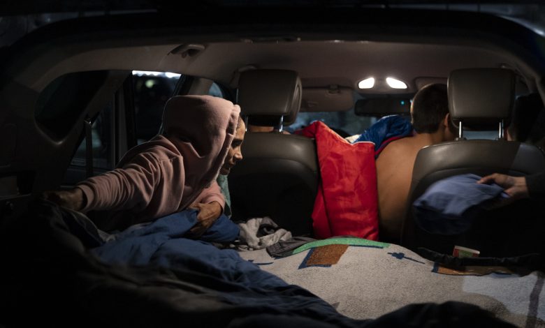 A family of 5 lives in a car as they save for housing in a good school district : NPR