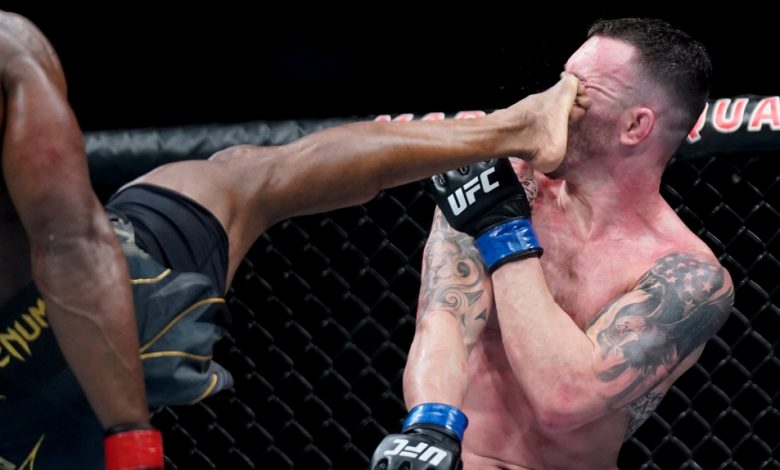 Kamaru Usman lands a kick against Colby Covington during a welterweight mixed martial arts championship bout at UFC 268, Sunday, Nov. 7, 2021, in New York. (AP Photo/Corey Sipkin)