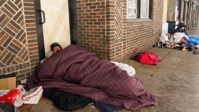 People living on the streets use blankets to keep warm, Thursday, Feb. 18, 2021, in downtown San Antonio. Snow, ice and sub-freezing weather continue to wreak havoc on the state's power grid and utilities.