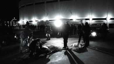 FILE - In this Dec. 3, 1979 file photo, Cincinnati police officers help people crushed during a performance by the rock group The Who in Cincinnati, Ohio. Eleven fans of the rock band were killed when a thousands-strong crowd stampeded to get into Cincinnat's riverfront coliseum.