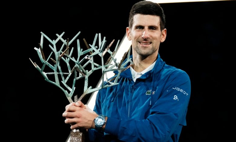Serbia's Novak Djokovic holds his trophy after defeating Russia's Daniil Medvedev in the final match of the Paris Masters tennis tournament at the Accor Arena in Paris, Sunday, Nov.7, 2021. Djokovic won 4-6, 6-3, 6-3. (AP Photo/Thibault Camus)