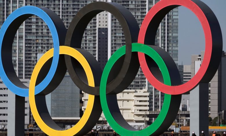 FILE - In this Dec. 1, 2020, file photo, the Olympic Symbol is reinstalled after it was taken down for maintenance ahead of the postponed Tokyo 2020 Olympics in the Odaiba section, in Tokyo. (AP Photo/Eugene Hoshiko, File)