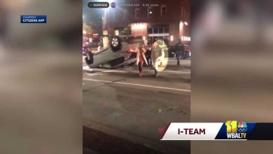 Video shows squeegee worker helping save woman from crash