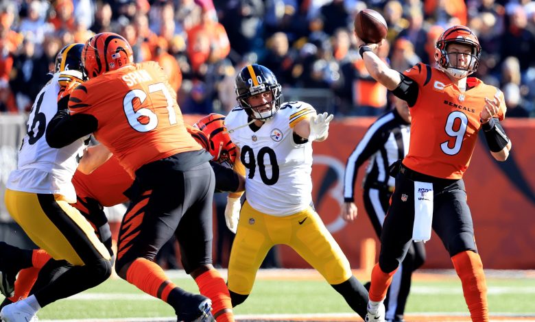Steelers' TJ Watt throws Joe Burrow to the ground in the first half of the game against the Bengals