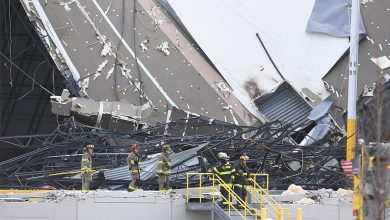 First responders survey a damaged Amazon Distribution Center on December 11, in Edwardsville, Illinois. (Michael B. Thomas/Getty Images)