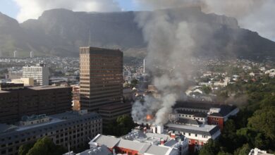 Firefighters battle a blaze at the South African parliament building in Cape Town