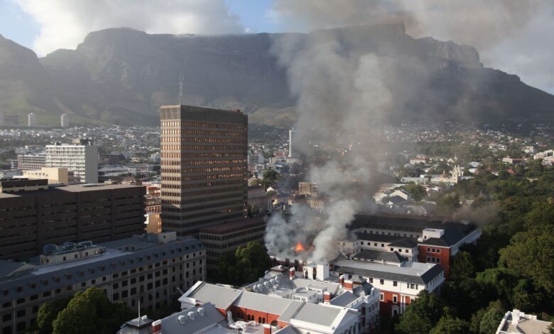 Firefighters battle a blaze at the South African parliament building in Cape Town