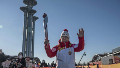 Olympic torch begins its Covid-shortening trip through Beijing landmarks