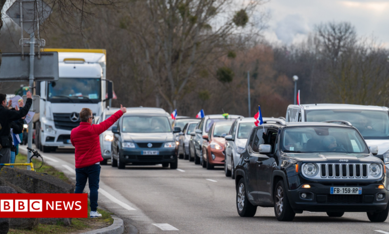 Macron calls for calm as convoy protests near Paris