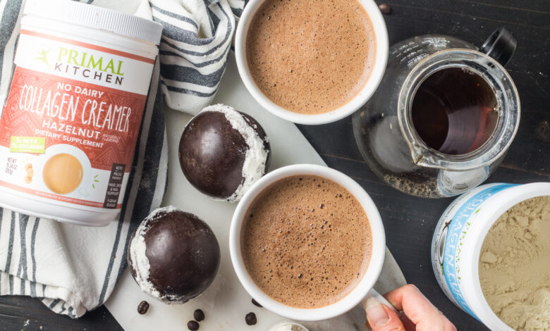 Two cups of coffee with chocolate collagen bombs, Primal Kitchen Hazelnut and Vanilla Collagen Fuel canisters