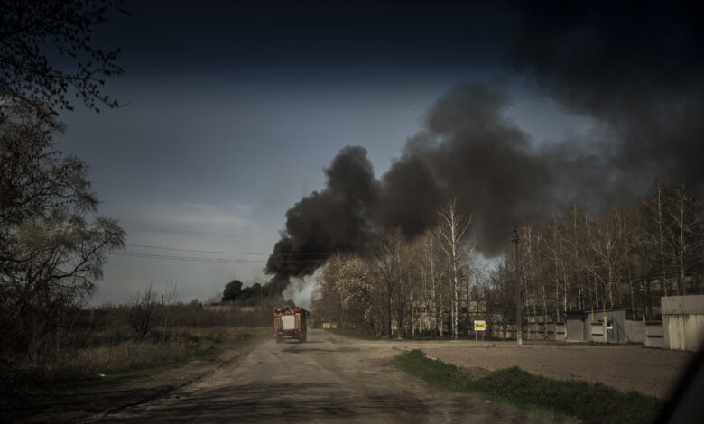 Firefighters drive towards a fire at a factory after a Russian attack, on the outskirts of Kharkiv, Ukraine, on April 15.