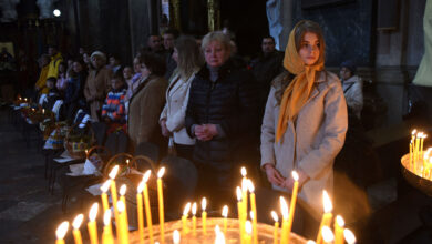Worshippers attend a service marking Orthodox Easter at Saints Peter and Paul Garrison Church, in Lviv, on Saturday, April 23. Ukrainian authorities urged those celebrating Orthodox Easter to follow religious services online and to respect curfews amid fighting with Russian troops despite a holiday that usually attracts crowds.
