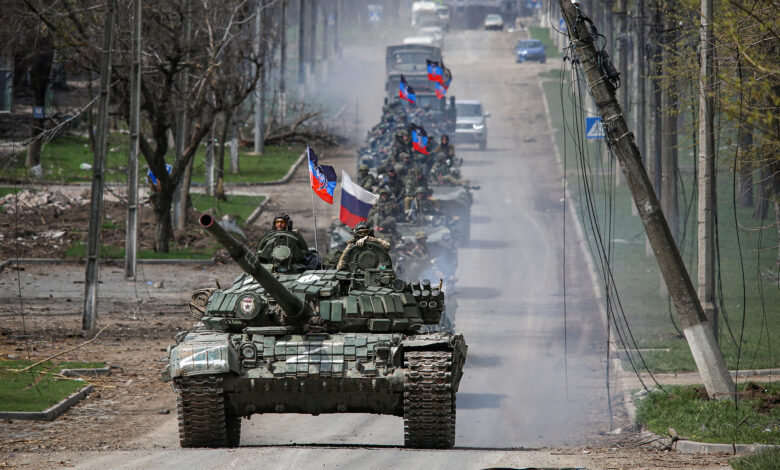 An armoured convoy of pro-Russian troops moves along a road in the southern port city of Mariupol, Ukraine, on April 21.