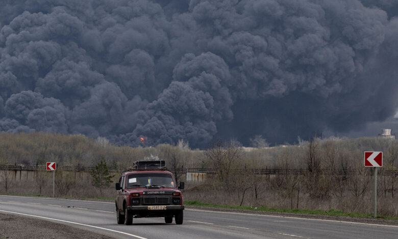 A car passes an oil refinery in Lysychansk after if was hit by a missile in the Luhansk region in Ukraine on Saturday.