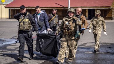 Ukrainian soldiers clear out bodies after a rocket attack at a train station in Kramatorsk, eastern Ukraine, on April 8.