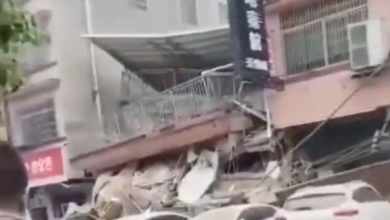 Footage on social media showed people stood watching in shock as the building collapsed. Pic: Twitter @LovingChinaMI.