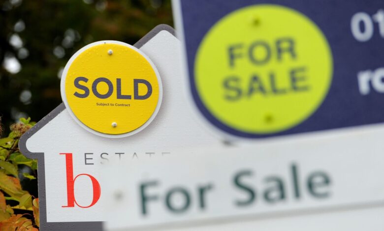 File photo dated 14/10/14 of estate agents signs.