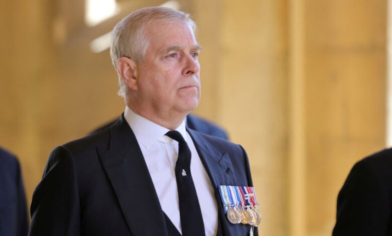 Prince Andrew looks on during his father's funeral