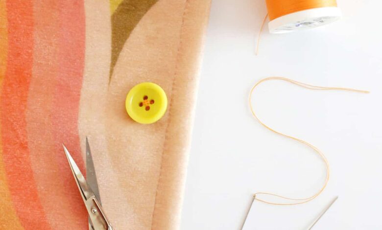 button sewn onto fabric