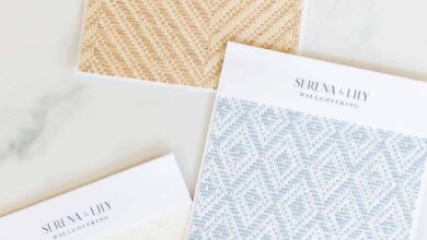 Wallpaper samples from Serena and Lily laid out on a marble surface.