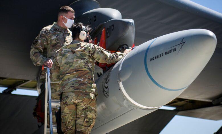 Master Sgt. John Malloy and Staff Sgt. Jacob Puente, both from 912th Aircraft Maintenance Squadron, secure the AGM-183A Air-launched Rapid Response Weapon Instrumented Measurement Vehicle 2 (ARRW IMV-2) as it is loaded under the wing of a B-52H Stratofortress at Edwards Air Force Base, California, U.S., August 6, 2020. Picture taken August 6, 2020. U.S. Air Force/Giancarlo Casem/Handout via REUTERS