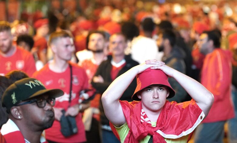 Liverpool fans in the fanzone in Paris, react after seeing their team lose against Real Madrid in the UEFA Champions League Final at the Stade de France. Picture date: Saturday May 28, 2022