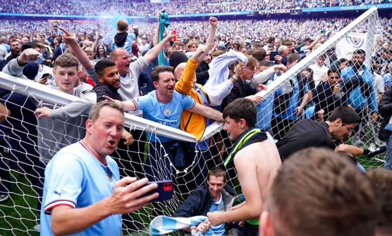 Manchester City fans stormed the pitch following the Premier League win