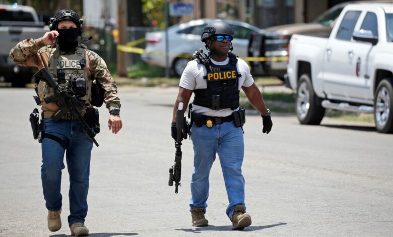 Police walk near the Robb Elementary school in Uvalde, Texas, Tuesday 24 May 2022 (AP Photo/Dario Lopez-Mills)..