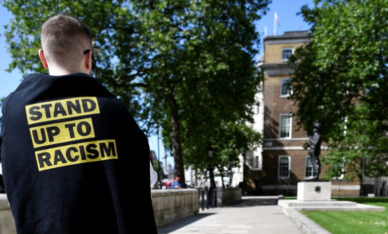 A protester takes part in a demonstration against racism outside Downing Street in London, Britain July 17, 2021. REUTERS/Beresford Hodge