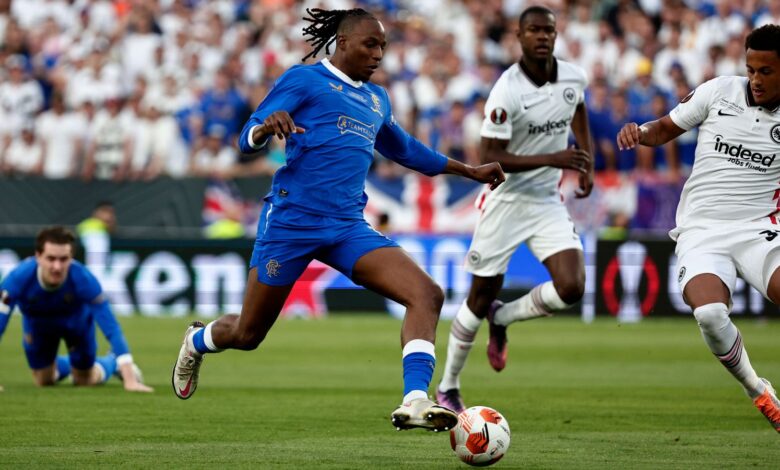 Rangers' Joe Aribo, left, tries to control a ball during the Europa League final soccer match between Eintracht Frankfurt and Rangers FC at the Ramon Sanchez Pizjuan stadium in Seville, Spain, Wednesday, May 18, 2022. (AP Photo/Pablo Garcia)
