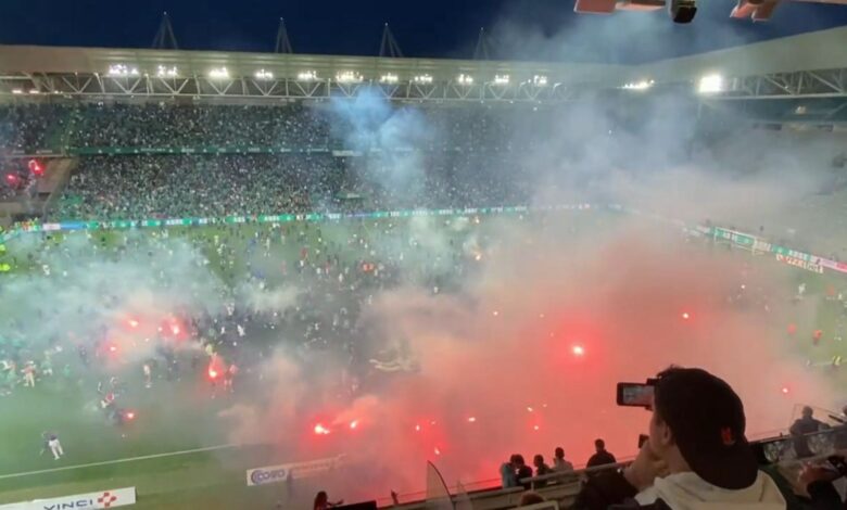 Football fans storm the pitch and set off flares after Saint-Etienne's relegation from Ligue 1 |  World News