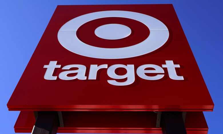 FILE - The bullseye logo on a sign outside a Target store is seen on Feb. 28, 2022. Target's first-quarter profit took a big hit from higher costs, despite strong sales growth. Target's results Wednesday, May 18, reflect the pressure on retailers' profits coming from surging inflation and persistent clogs in the supply chain. (AP Photo/Charles Krupa, File)
